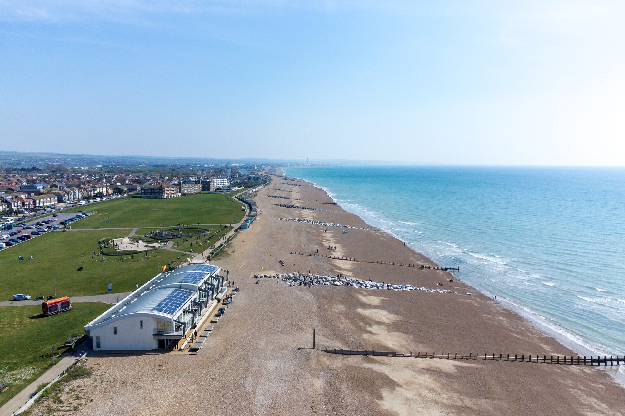 The seafront at Lancing from the air, with the beach, the sea and the apartments we manage